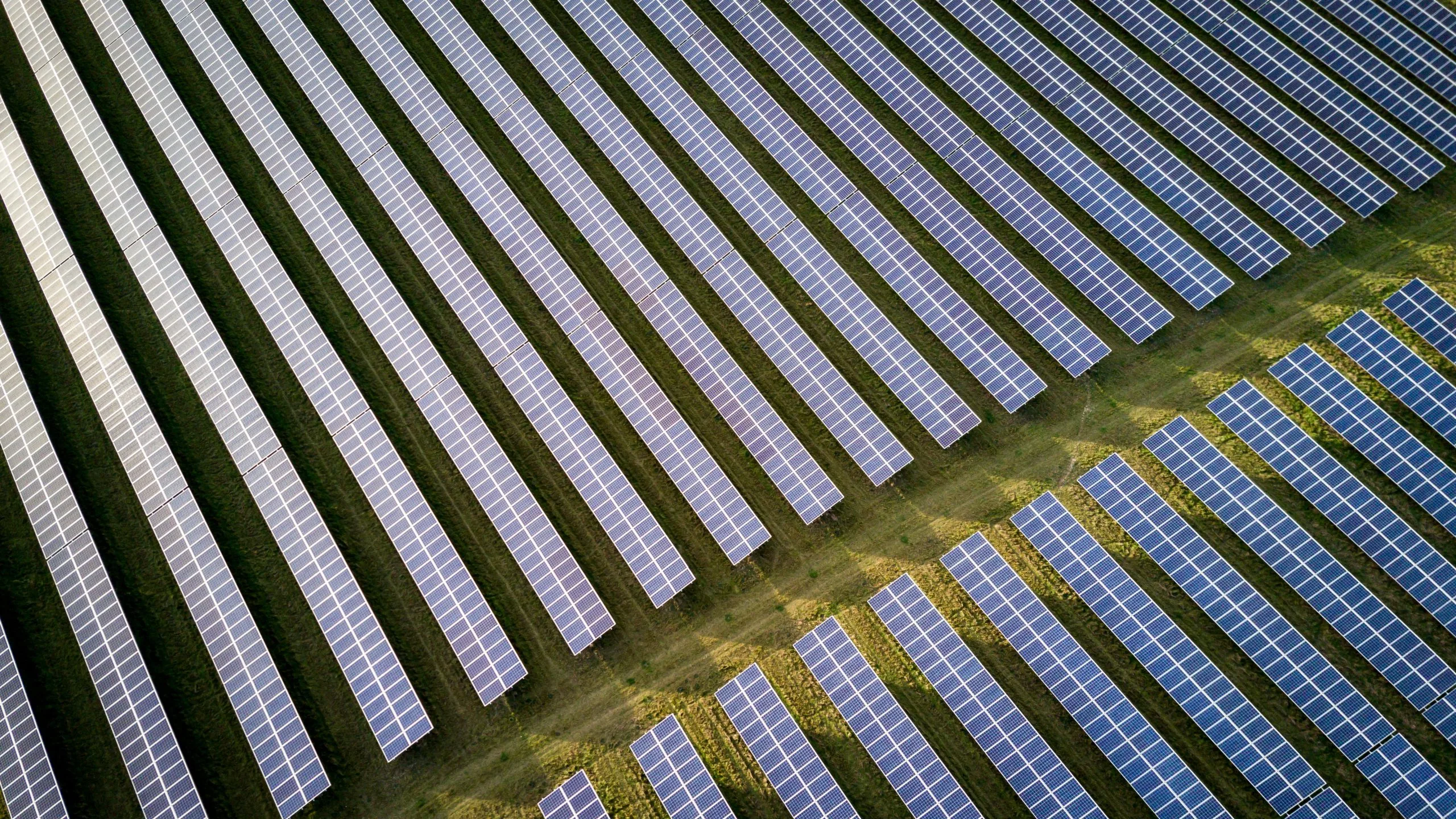 Bird's-eye view of a rural solar panel installation