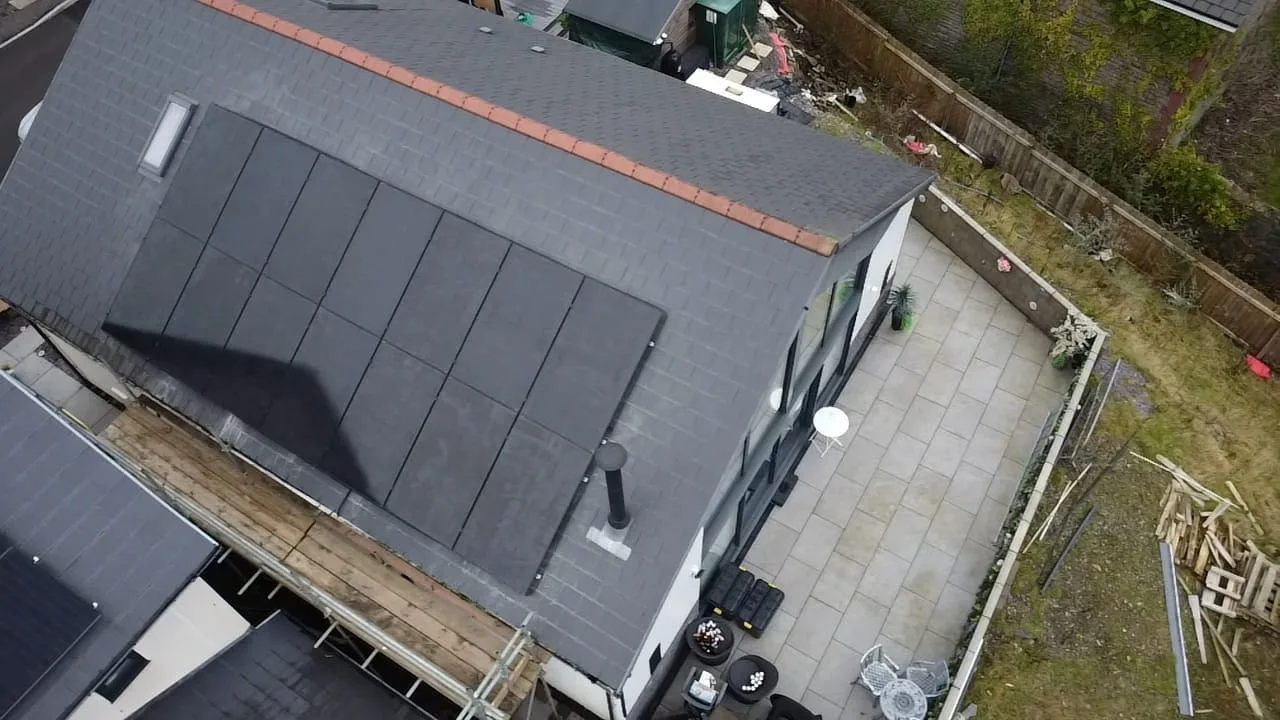 Aerial view of solar panels on roof, representing Leeds