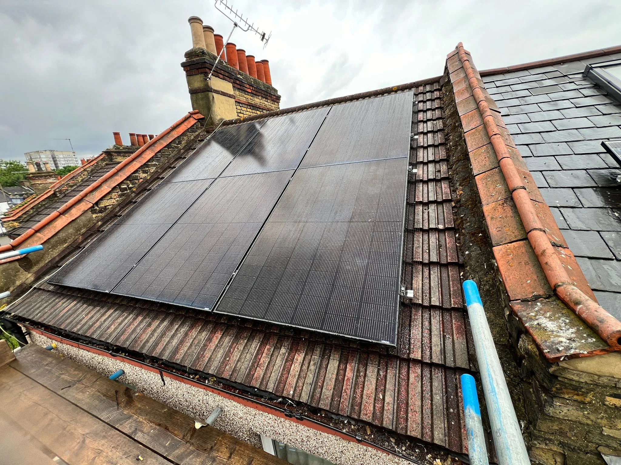 Rooftop solar panels on slate roof, representing Cambridge