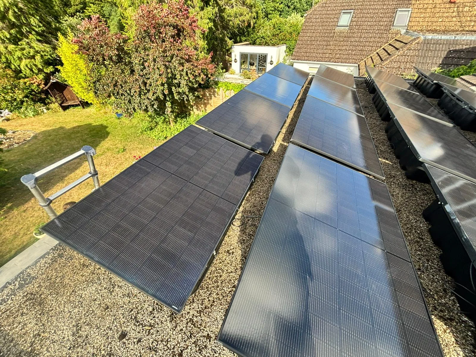 Rooftop solar panels over garden, representing Cardiff and South Wales
