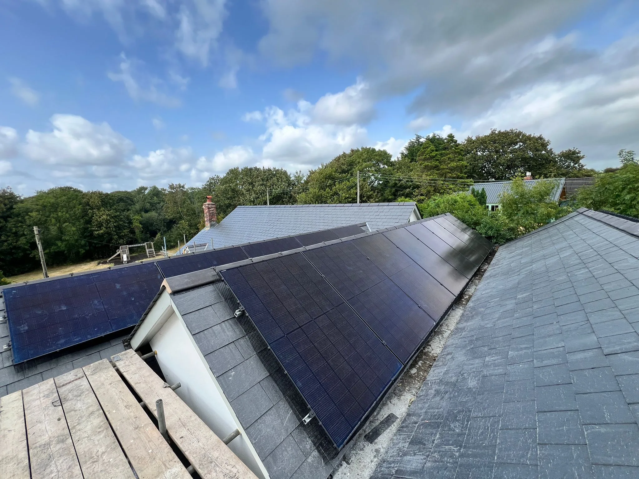 Solar panels on slate roofs, representing Birmingham