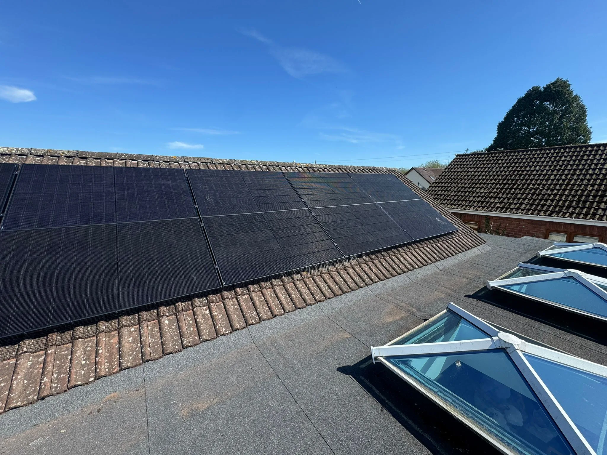 Solar panels on tiled roof, representing Liverpool